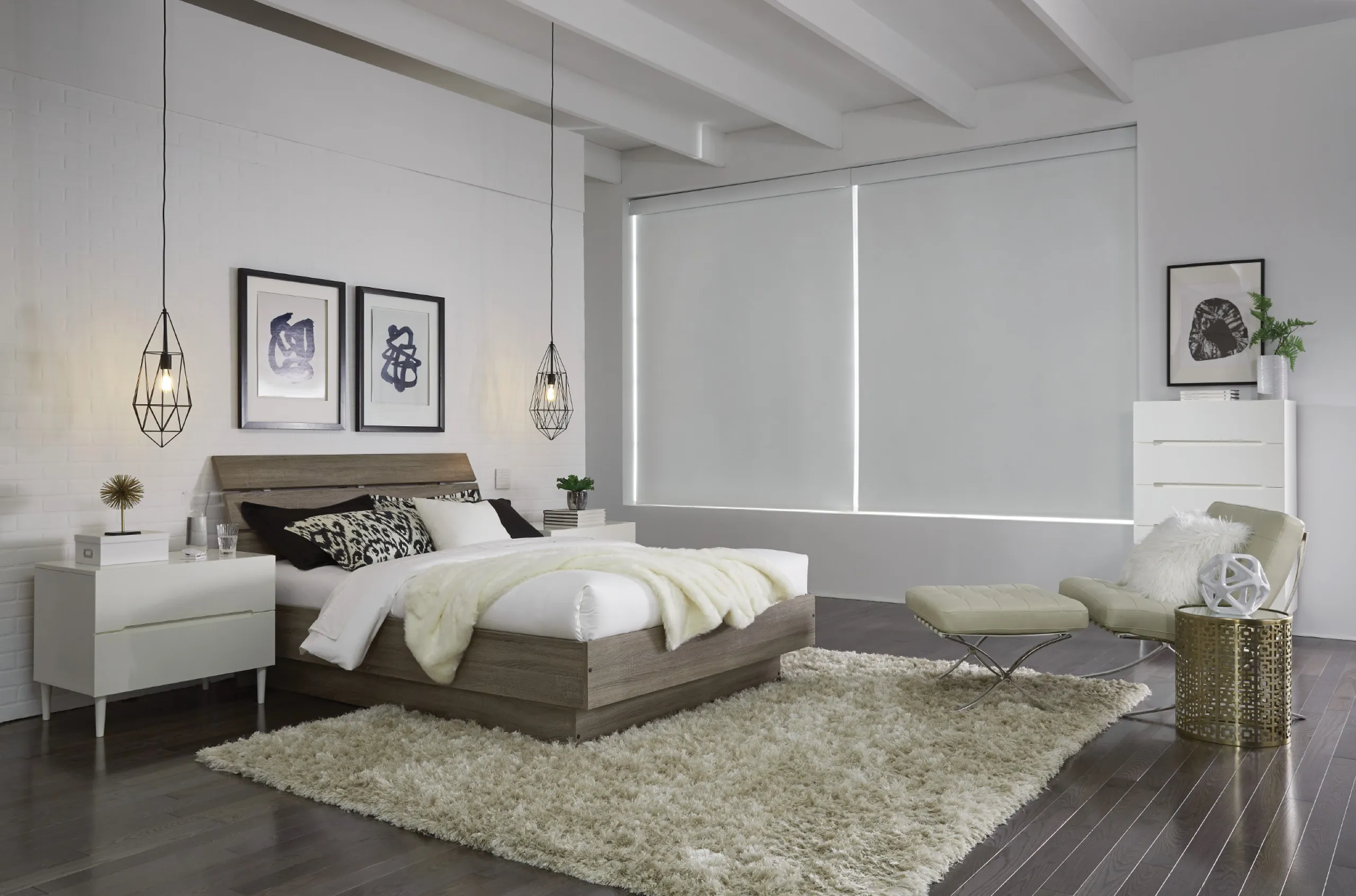 Modern white bedroom with fully closed white roller shades, platform bed, and geometric pendant lights.