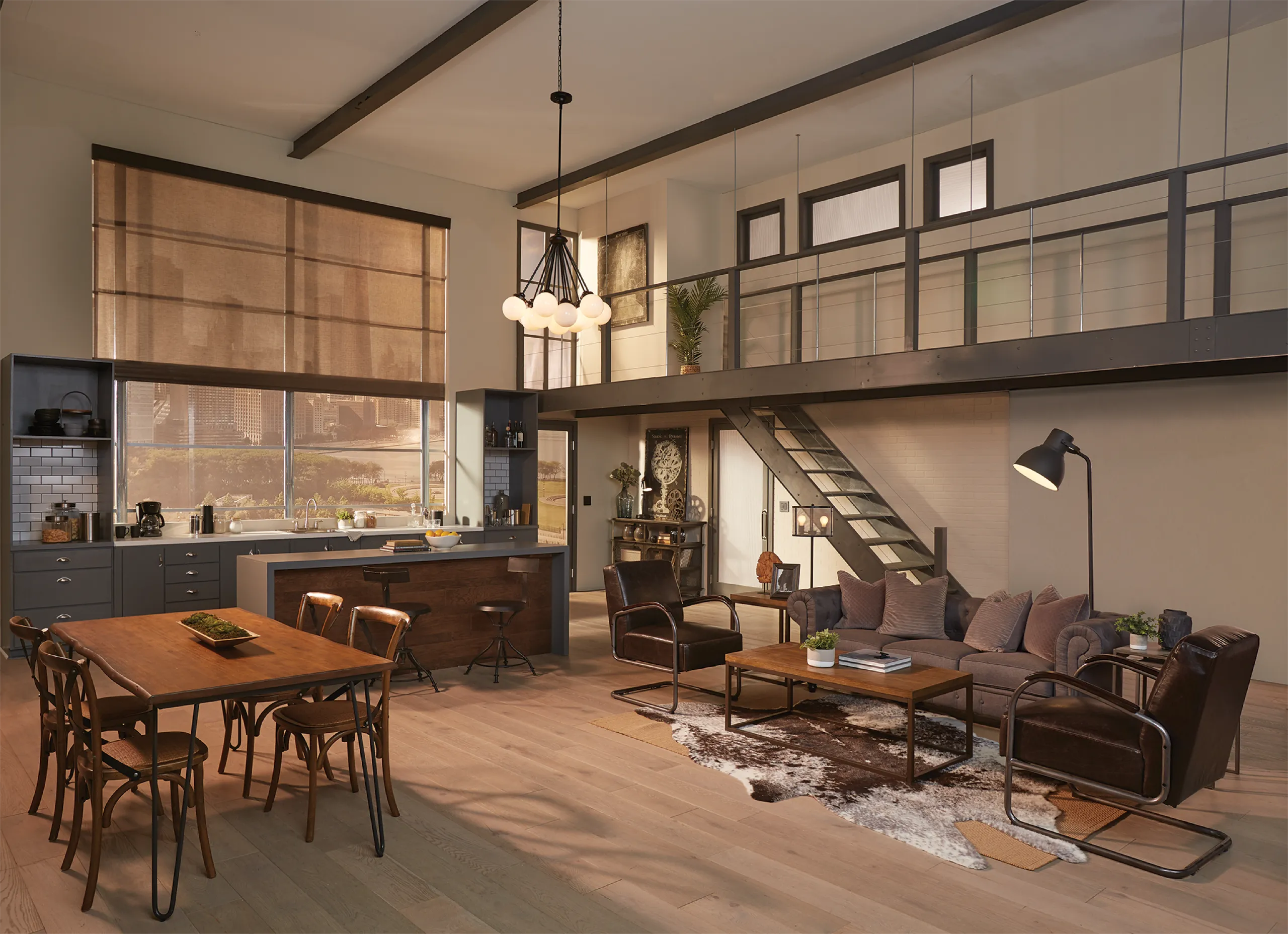 Industrial loft with dining, kitchen, and living areas under exposed beams and coordinated roller shades.